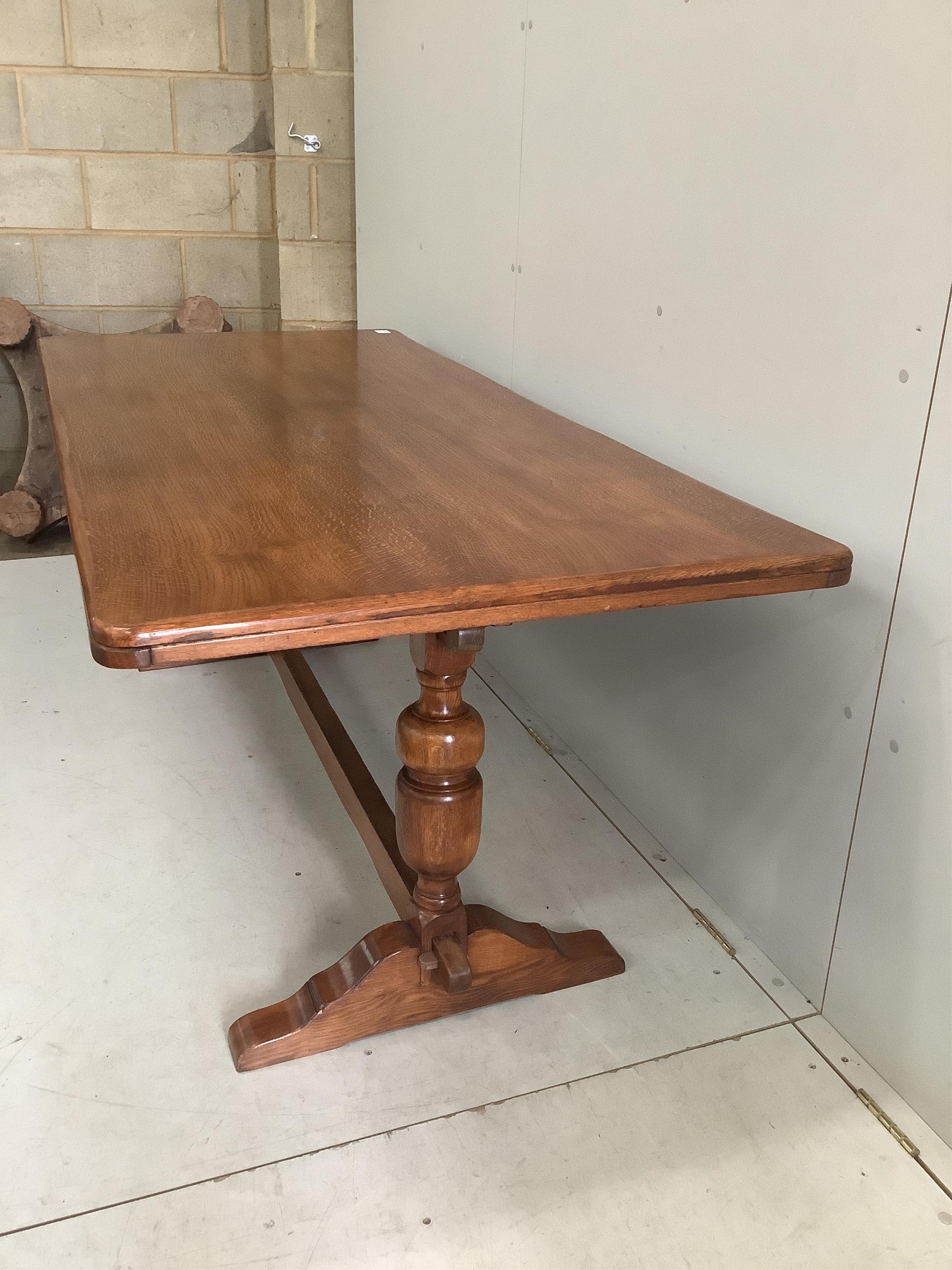 An 18th century style rectangular oak refectory dining table, width 182cm, depth 83cm, height 71cm together with six early 20th century oak dining chairs